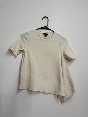 Women’s cream colored asymmetric top